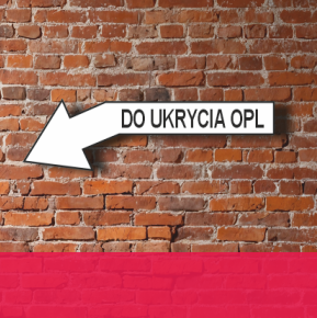 mur z tablicą wskazującą drogę do miejsca ukrycia